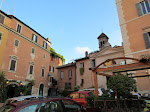 Lots of quaint, colorful buildings, cobblestone streets, and outdoor shops and restaurants. So unlike the main part of Rome, but still so connected d Lots of quaint, colorful buildings, cobblestone streets, and outdoor shops and restaurants. So unlike the main part of Rome, but still so connected d