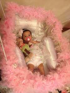 Qarla all cozy in her cradle