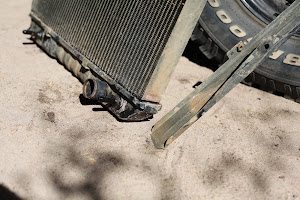 Sheared radiator mounting bracket