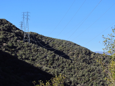 high tension wires looping over the hills