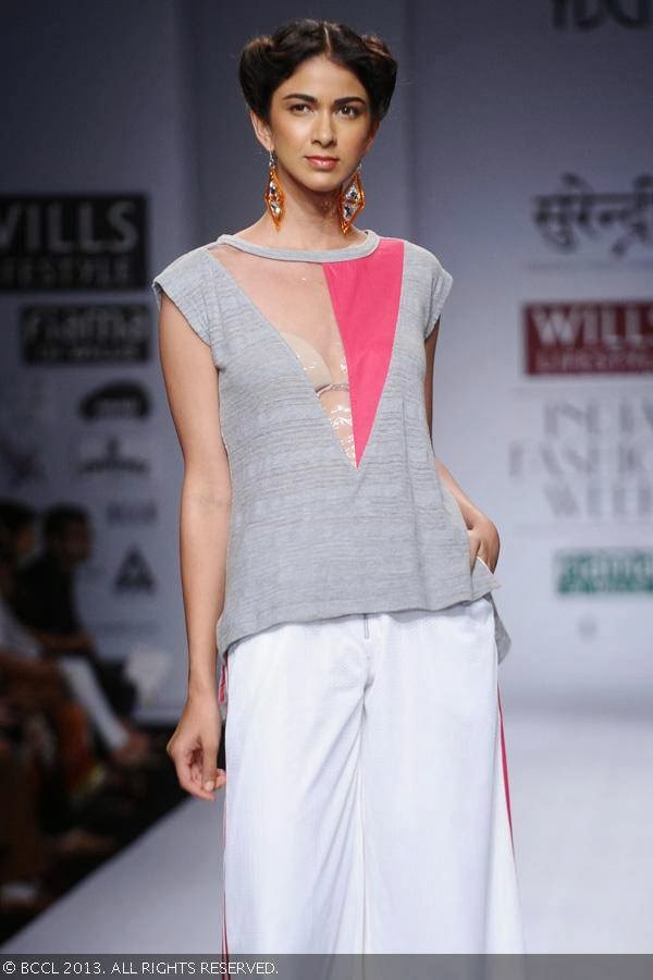 A model walks the ramp for fashion designer Yogesh Chaudhary on Day 4 of Wills Lifestyle India Fashion Week (WIFW) Spring/Summer 2014, held in Delhi.