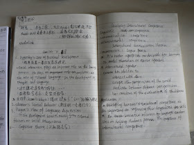 open notebook with notes in both Chinese and English