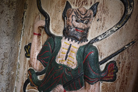 carved and painted figure on a wall at A-Ma Temple in Macau