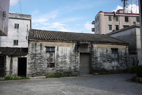 older building and newer apartment complex in Hetoupu, Zhuhai, China