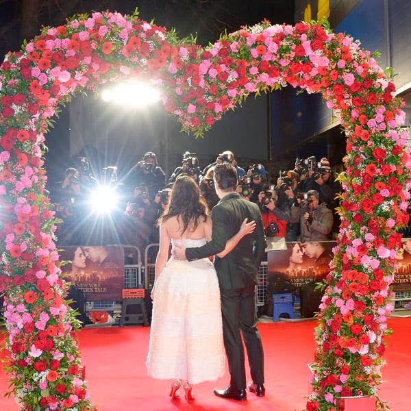 Jessica Brown Findlay and Irish actor Colin Farrell pose for photographers on the red carpet for A New York Winter's Tale UK Premiere at the Odeon Kensington on Thursday Feb. 13, 2014, in London.