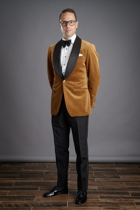 a man wearing a light brown dinner jacket