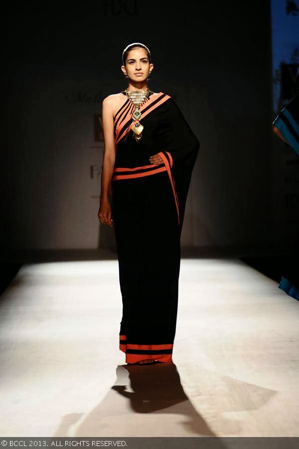 Margarita showcases a creation by fashion designer Malini Ramani on Day 1 of Wills Lifestyle India Fashion Week (WIFW) Spring/Summer 2014, held in Delhi.