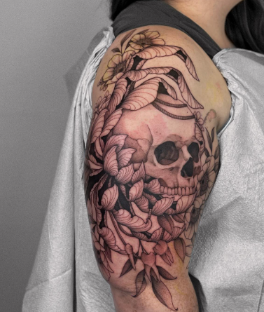 Skull Covered In Chrysanthemum Tattoo