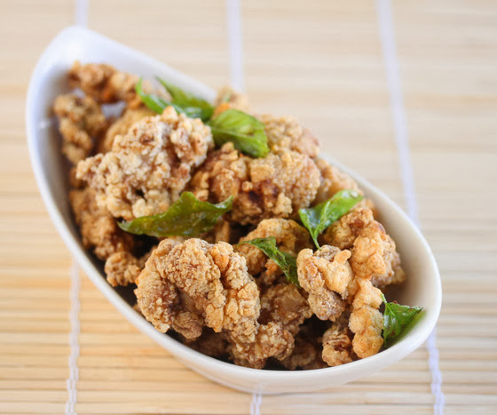 Taiwanese popcorn chicken in a dish garnished with herbs