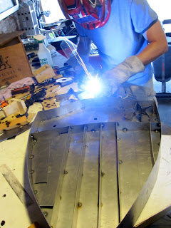 James welding one of the stars for the Captain American light up sign