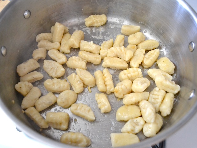 gnocchi added to butter and garlic in skillet 