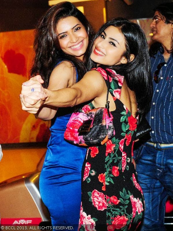 Karishma Tanna and Mouni Roy get into the festive mood during pre-christmas party, held at Amoeba, in Mumbai, on December 18, 2013. 