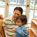 Toddlers have fun painting at easels just their size.