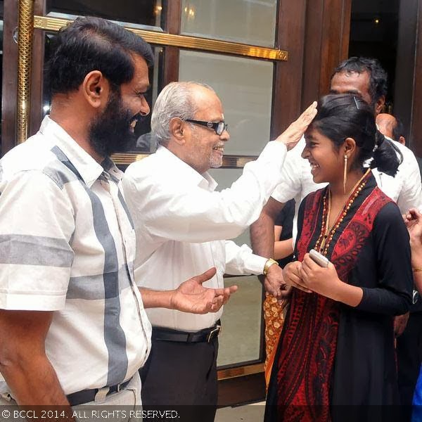 Balachander blesses a kid during the wedding reception party of T Rajendar's daughter Elakkiya with Abhilash, held at The Leela Palace in Chennai.