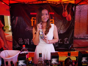 young woman holding a bottle of finsta alcohol