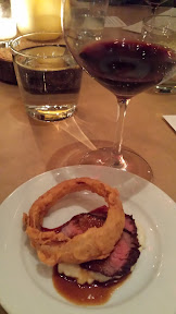 Fifth course, Beautiful serving of Irving St Kitchen Teres Major Steak with garlic grits, ancho ketchup, onion rings, marrow sauce paired with 2010 Hawks View Washington Cabernet Sauvignon