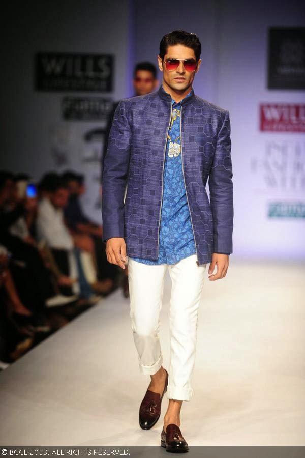A model walks the ramp for fashion designers Ashish Viral and Vikrant on Day 5 of Wills Lifestyle India Fashion Week (WIFW) Spring/Summer 2014, held in Delhi.