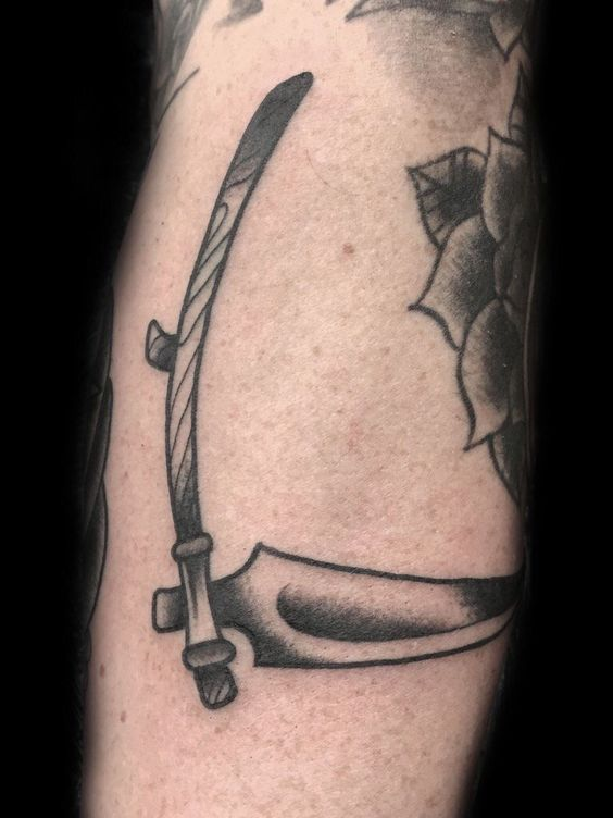 Another picture showing off the scythe tattoo design