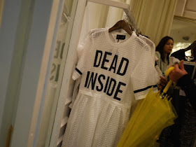 dress with "DEAD INSIDE" written in large block characters