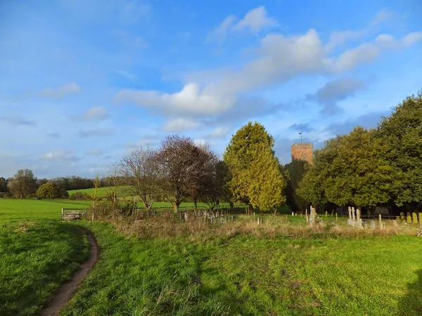 Carlton church hiding in the copse in Carlton Park