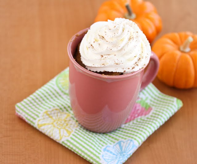 photo of a Pumpkin Spice Latte Mug Cake topped with whipped cream