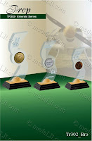 Prop The Emerald series of trophies are carefully designed and elaborately finished to guarantee aesthetic proportions, elegant style and luxury appearance. They are made from acrylic sheets, (in addition to the standard crystal clear on top of piano black base, a wide selection of colours are available.) The series features a 3 steps base with a metallic base top and a metallic clip, no glue is applied to hold the body and the base together.  www.medalit.com - Absi Co