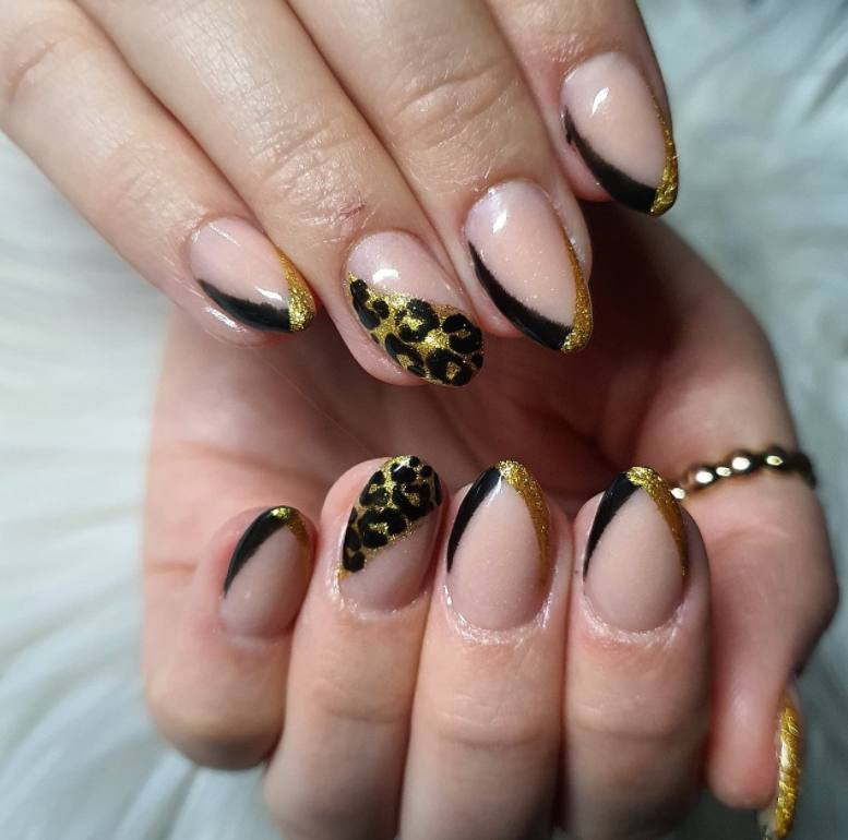 Animal Print With Black And Gold Nail Design