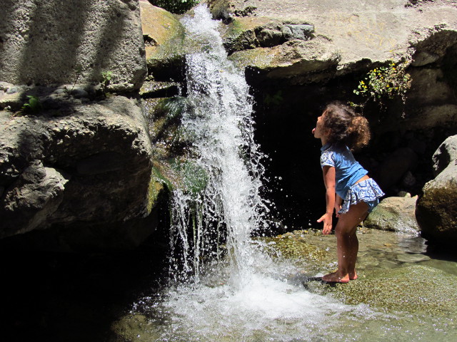 one three year old by the waterfall over the old water gauge