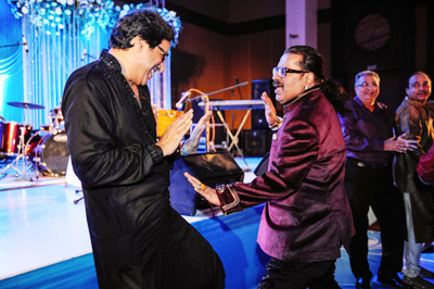 Talat Aziz and Hariharan get into the dance mood during the latter's son Akshay's sangeet ceremony, held in Mumbai on January 28, 2013. 