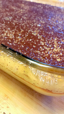 Initial layer of chocolate which melted when I grated it onto my recipe for Whiskey and Orange Flavored Ricotta Cheese Cake with Chocolate