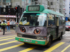 Hong Kong mini-bus with cat eyes on the front as part of an advertisement for the Shatin Animal Clinic