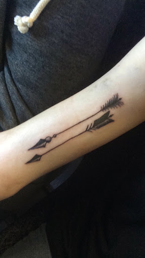 arrow tattoo design on the forearm