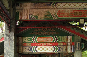 beams of Chinese pavilion at the Rizal Park with faded paintings