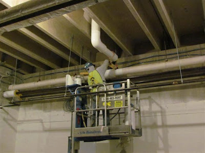 Pipe insulation being installed Pipe insulation being installed