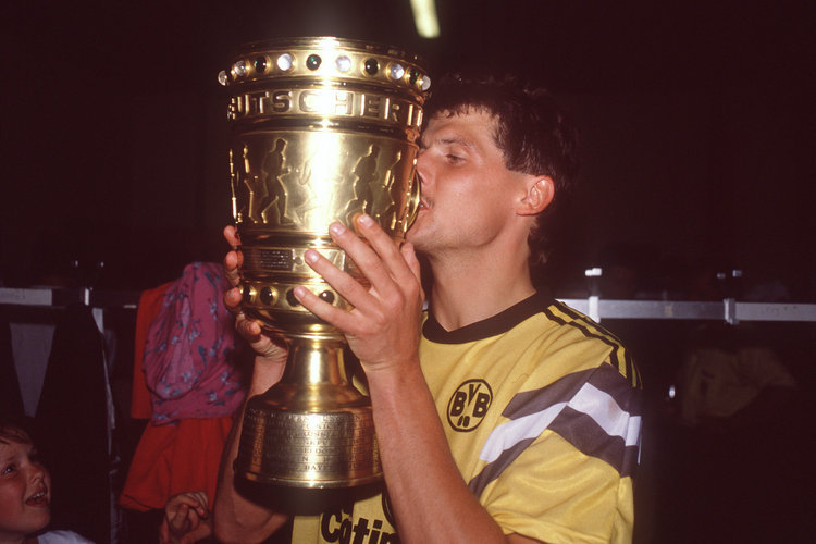 Norbert%2520Dickel%2520kisses%2520the%2520German%2520Cup%2520after%2520winning%2520it%2520with%2520Borussia%2520Dortmund%2520in%25201989.%2520They%2520beat%2520Werder%2520Bremen%25204-1%2520in%2520the%2520final.