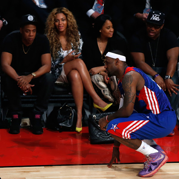 Rapper Jay-Z and Beyonce look over at LeBron James #6 of the Miami Heat and the Eastern Conference during the 2013 NBA All-Star game at the Toyota Center on February 17, 2013 in Houston, Texas.