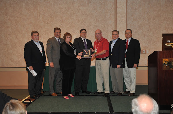 Rochester Regional Healthcare Advocates (RRHA) and Nassau Suffolk Hospital Council (NSHC) receive the 2010 American Hospital Association's PAC Most Valuable Player Award. From the left: Joseph McDonald, President and Chief Executive Officer of Catholic Health System, Daniel Sisto, President, HANYS, Diane Ashley, President, RRHA, Steven Kroll, HANYS PAC Treasurer, Kevin Dahill, President, NSHC, Richard Pollack, Executive Vice President, Advocacy and Public Policy, American Hospital Association, and Stephen Mills, HANYS PAC Steering Committee Chairman.