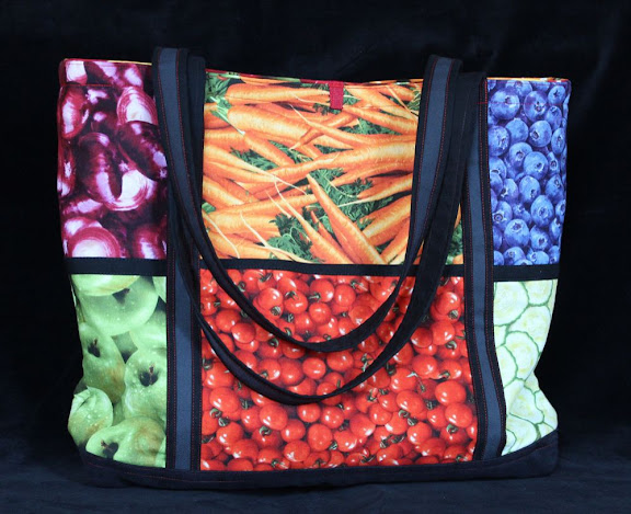 a tote bag made of fabrics with surprisingly realistic pictures of fruits and veggies