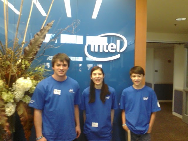 Us posing by the Intel sign for your viewing pleasure after a hard day refereeing FLL tournaments.