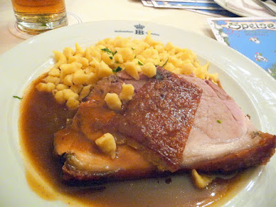 Roast pork from Bavarian production with crackling in natural gravy with Spaetzle egg noodles at Hofbrauhaus (enjoyed with a Dark Radler, which is their Dark Beer with lemonade