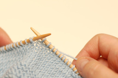 lifting the strand from back to front