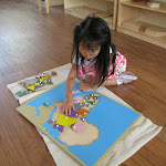 The Montessori preschool curriculum is rich in content. Here, a preschooler at the Palos Verdes campus is working on a puzzle map of Africa. During her three years in the preschool room, she'll make her own maps of all the continents, learning more geography than many children in elementary school know.
