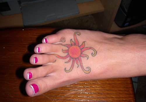 tribal sun tattoos