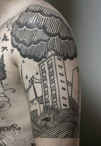 geometric clouds tattoos on his arm