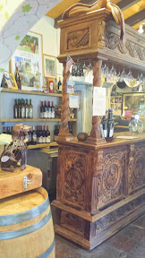 Hacienda de las Rosas huge hand-carved pinewood bar, try a flight of wine or microbrew beer