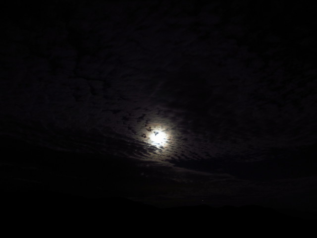 moon behind some thin clouds