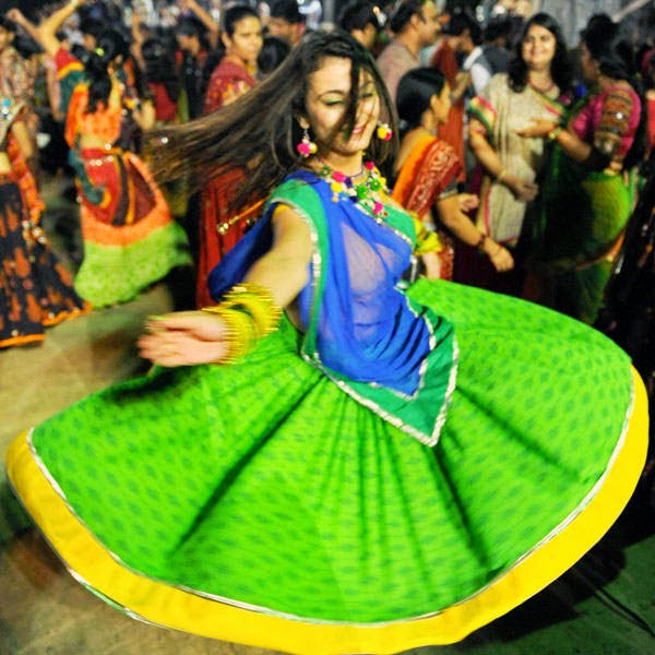Women in traditional dresses perform 'Garba' during 6th day of Navratri Festival celebration in Ahmedabad.