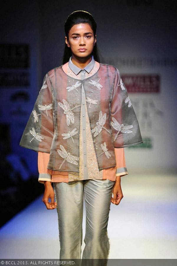 A model flaunts a creation by fashion designer Nachiket Barve on Day 1 of Wills Lifestyle India Fashion Week (WIFW) Spring/Summer 2014, held in Delhi.
