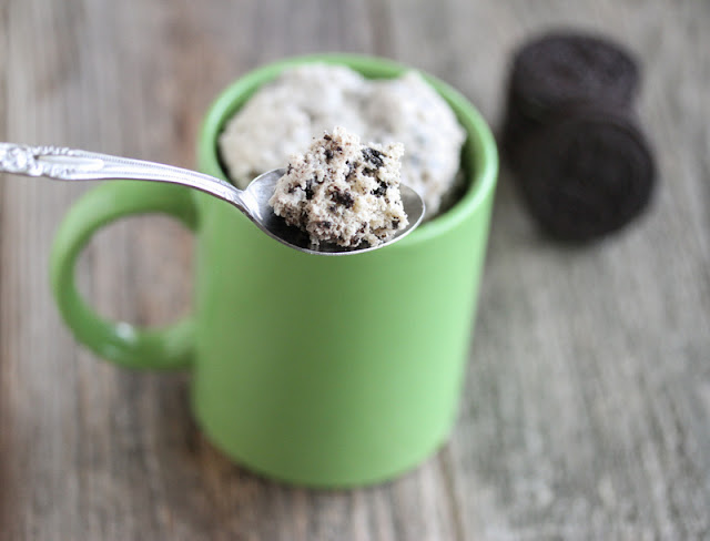 a photo of a spoonful of Oreo Cookies and Cream Mug Cake