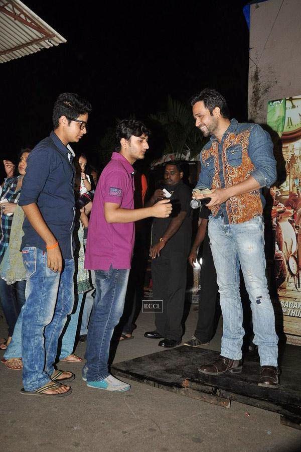 Emraan Hashmi gives away movie tickets of a recent Bollywood blockbuster to promote his upcoming film Raja Natwarlal at Gaitey, in Mumbai, on July 26, 2014. (Pic: Viral Bhayani)<br /> 